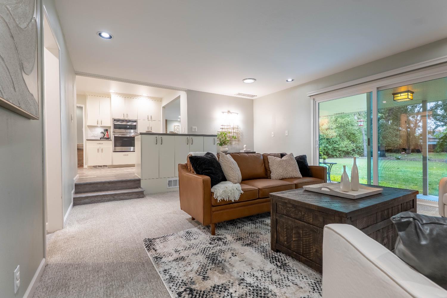4631 Nickles Way Sacramento, CA 95864 - Photo 16 of 40 a living room with furniture and a floor to ceiling window