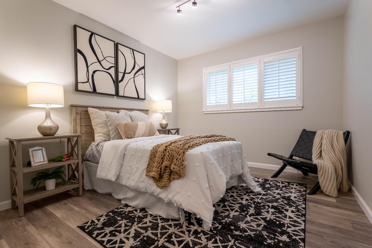 4631 Nickles Way Sacramento, CA 95864 - Photo 19 of 40 a bedroom with a bed and wooden floor