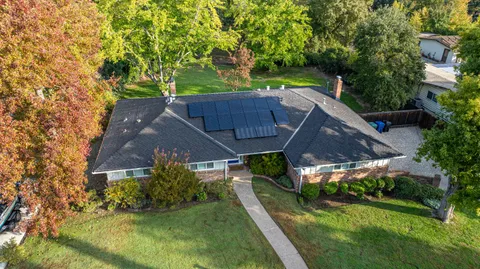 an aerial view of house with yard