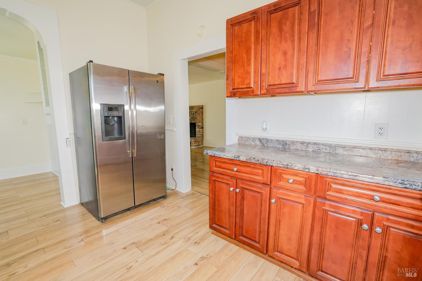 7948 North Meridian Road Dixon, CA 95620 - Photo 14 of 59 a kitchen with stainless steel appliances granite countertop a refrigerator a sink and dishwasher with wooden floor