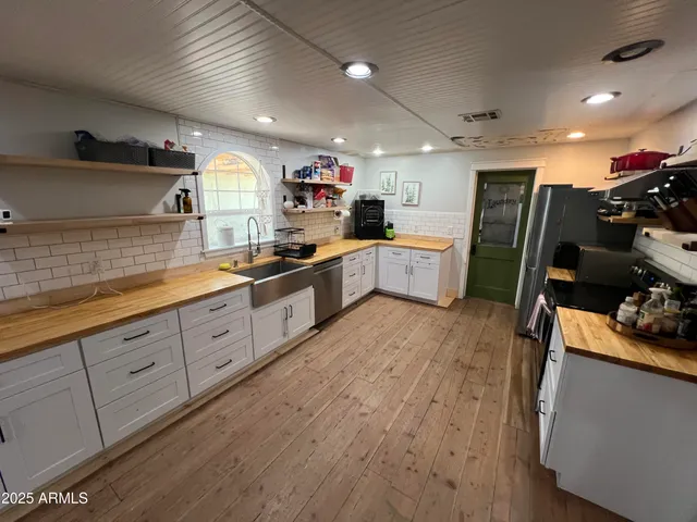 a kitchen with sink cabinets and window