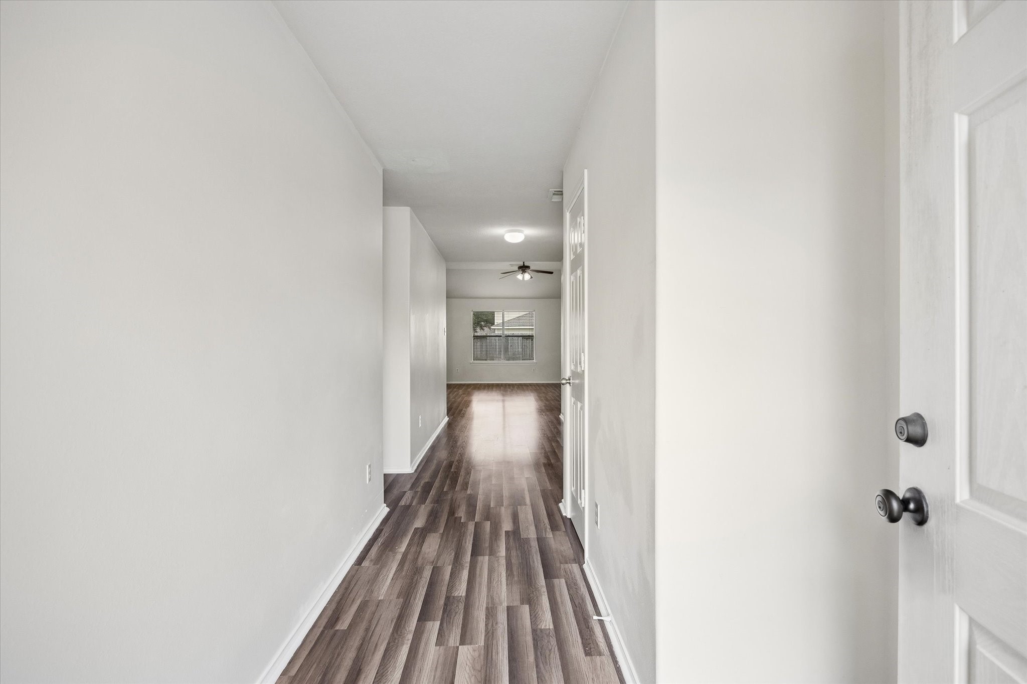 2614 Balsam Ridge Way Fresno, TX 77545 - Photo 2 of 14 a view of a hallway with wooden floor
