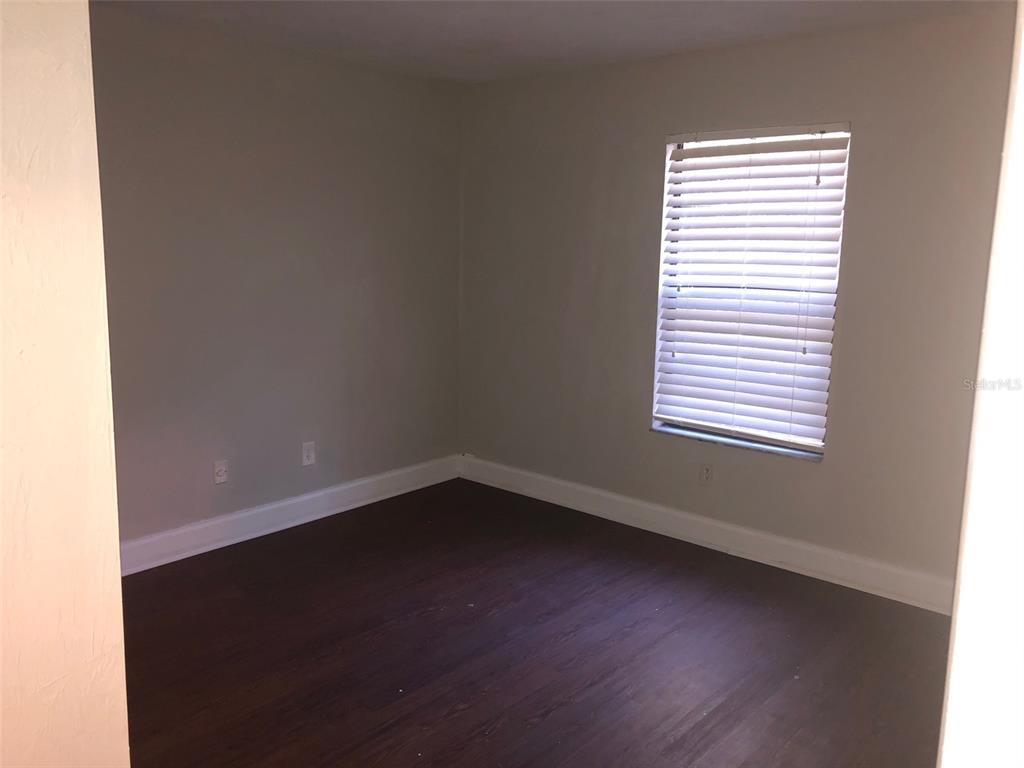 7213 Southwest 44th Place, Unit 6 Gainesville, FL 32608 - Photo 5 of 12 an empty room with a window