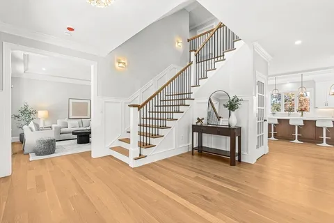 a view of living room filled with furniture and wooden floor