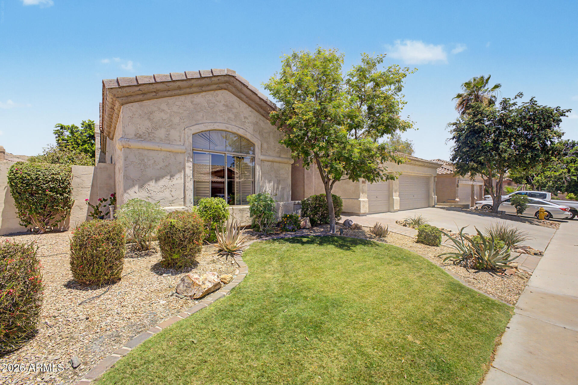 1632 West Frye Road Phoenix, AZ 85045 - Photo 2 of 37 a front view of a house with a yard