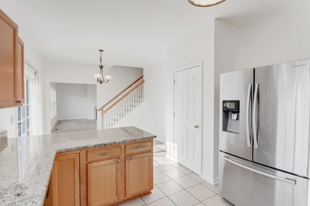 a view of a kitchen with a refrigerator cabinets and a sink