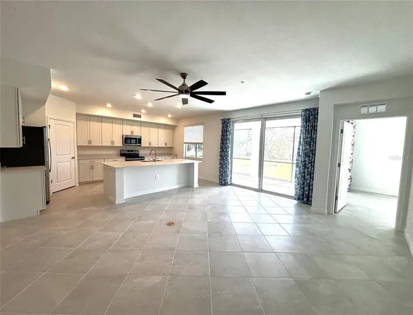 a view of a kitchen with a sink and a stove top oven