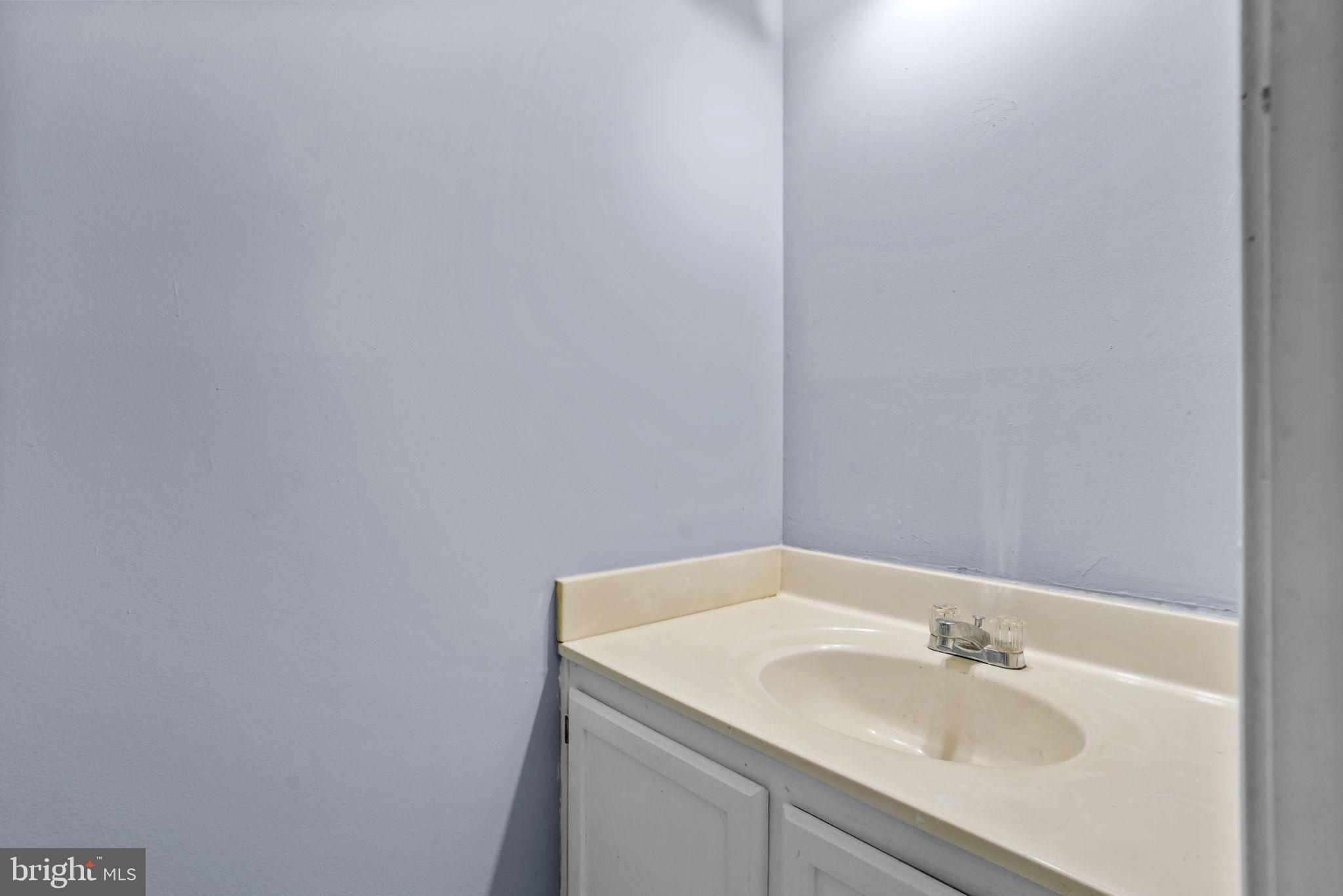 11206 Hannah Way, Unit 4 Upper Marlboro, MD 20774 - Photo 15 of 25 a bathroom with a sink and a mirror