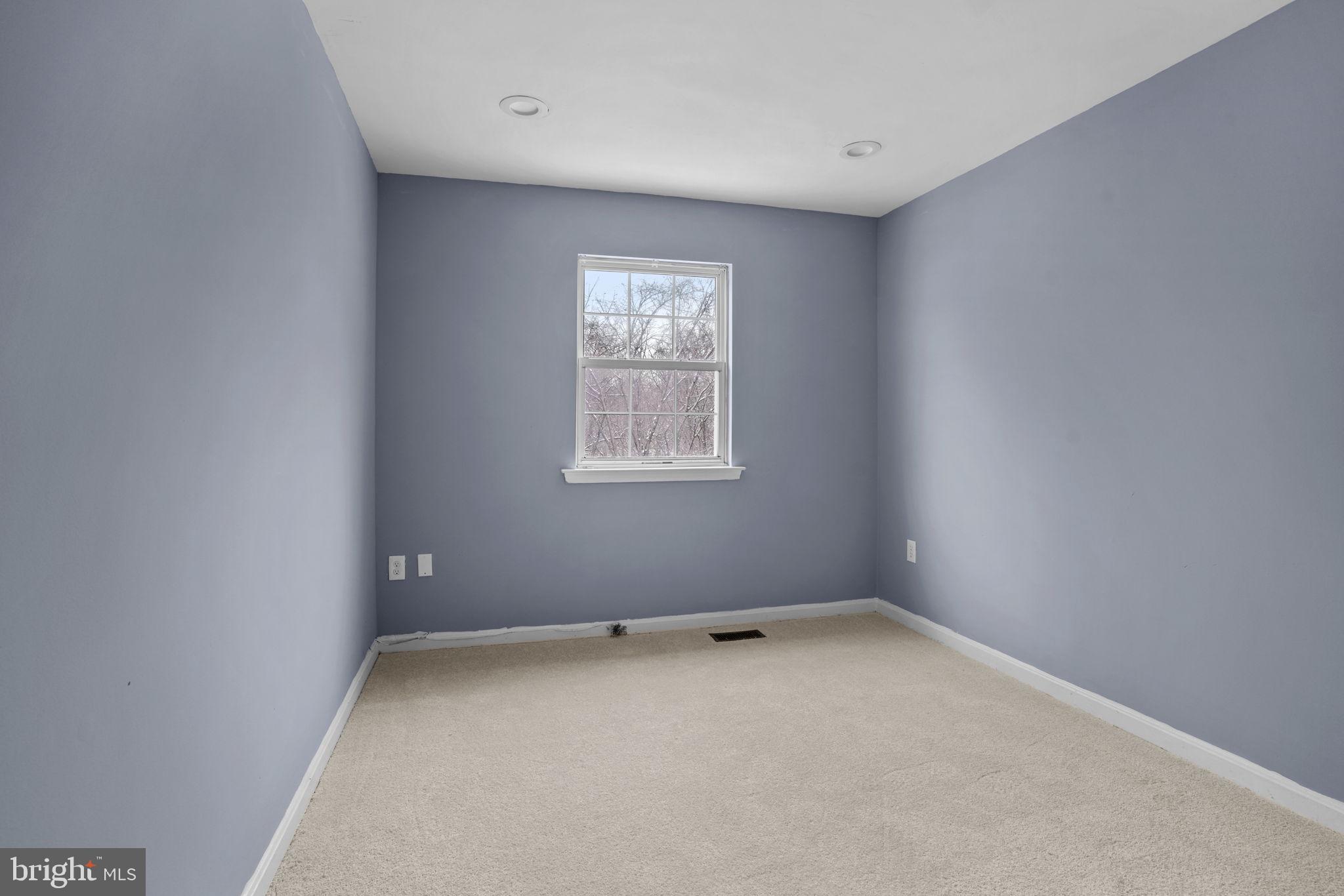 11206 Hannah Way, Unit 4 Upper Marlboro, MD 20774 - Photo 16 of 25 an empty room with a window