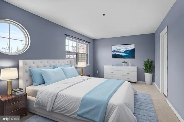 a bedroom with bed and a chair