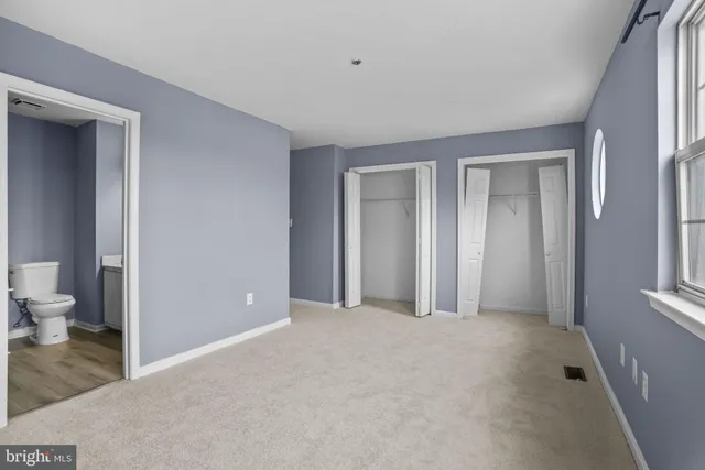 a view of a room with a wardrobe space