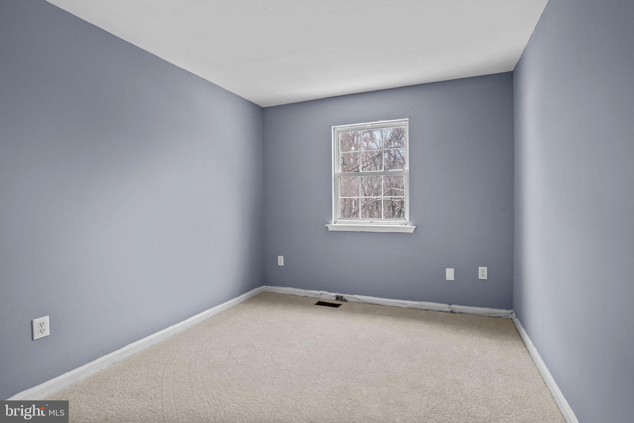 11206 Hannah Way, Unit 4 Upper Marlboro, MD 20774 - Photo 22 of 25 a view of an empty room with a window