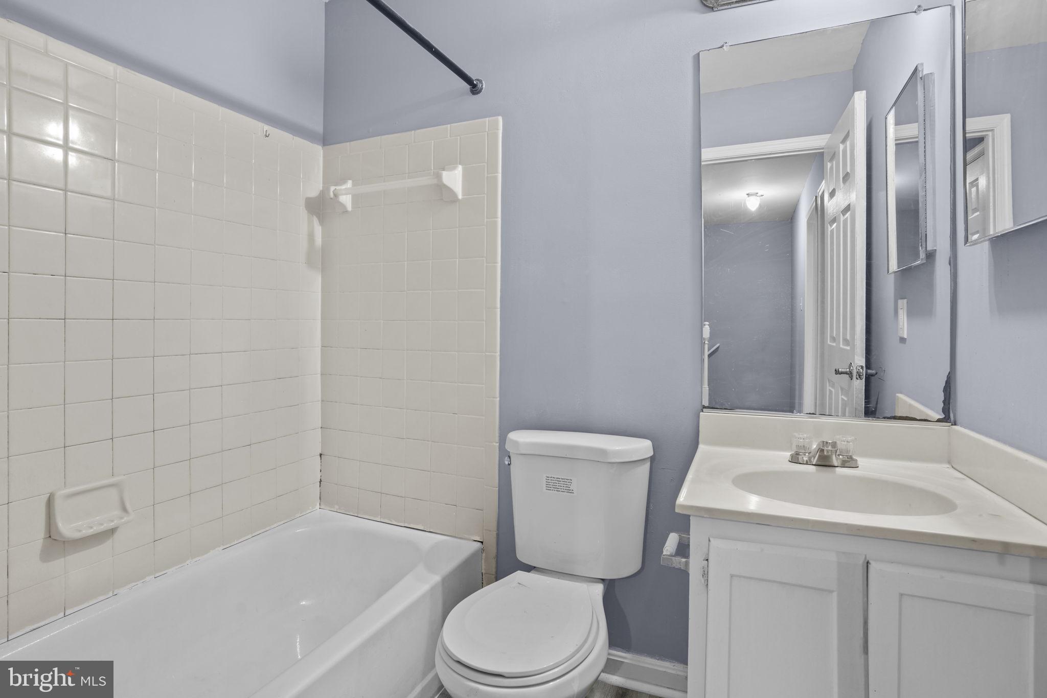 11206 Hannah Way, Unit 4 Upper Marlboro, MD 20774 - Photo 24 of 25 a bathroom with a sink toilet and shower