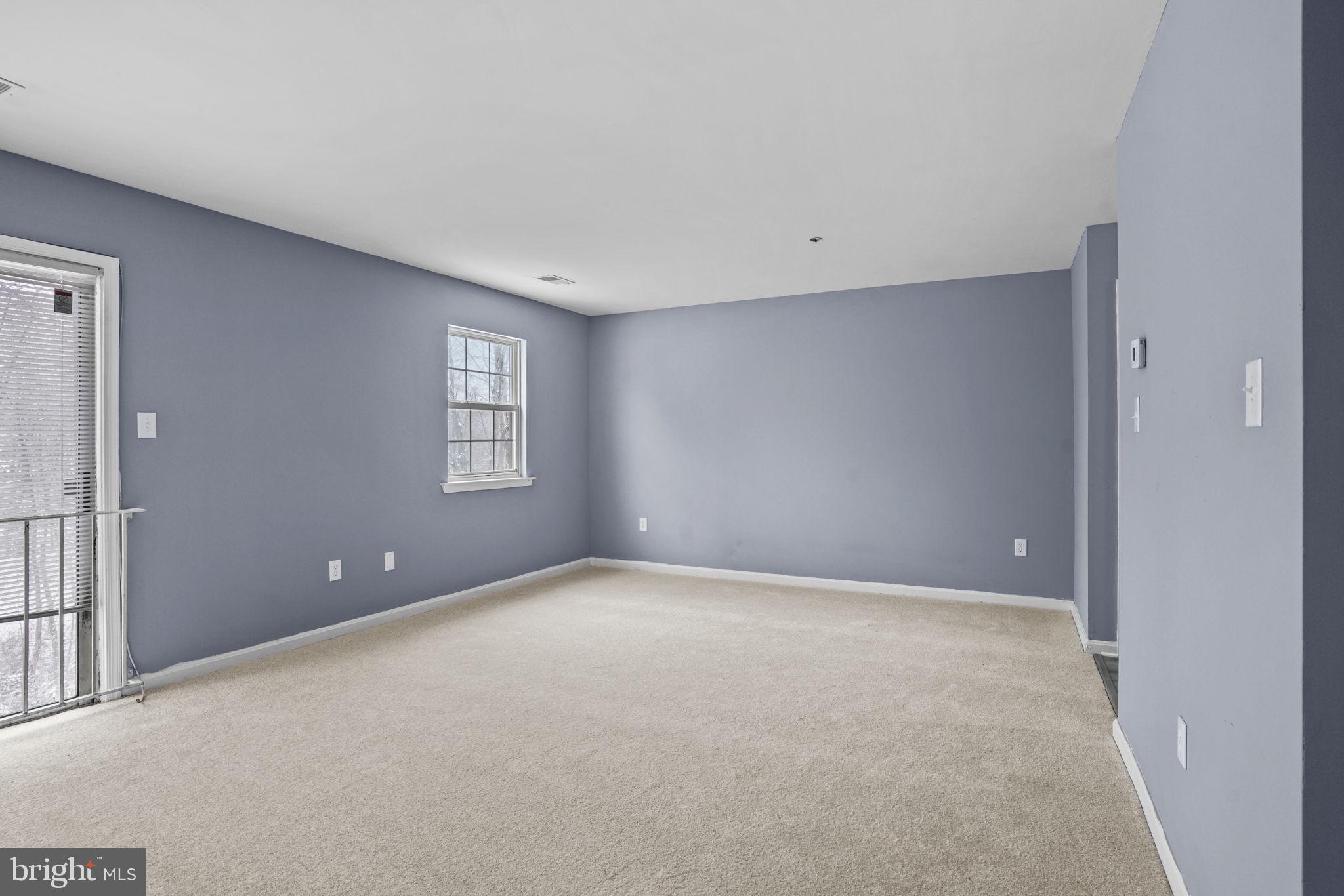 11206 Hannah Way, Unit 4 Upper Marlboro, MD 20774 - Photo 6 of 25 a view of an empty room with windows