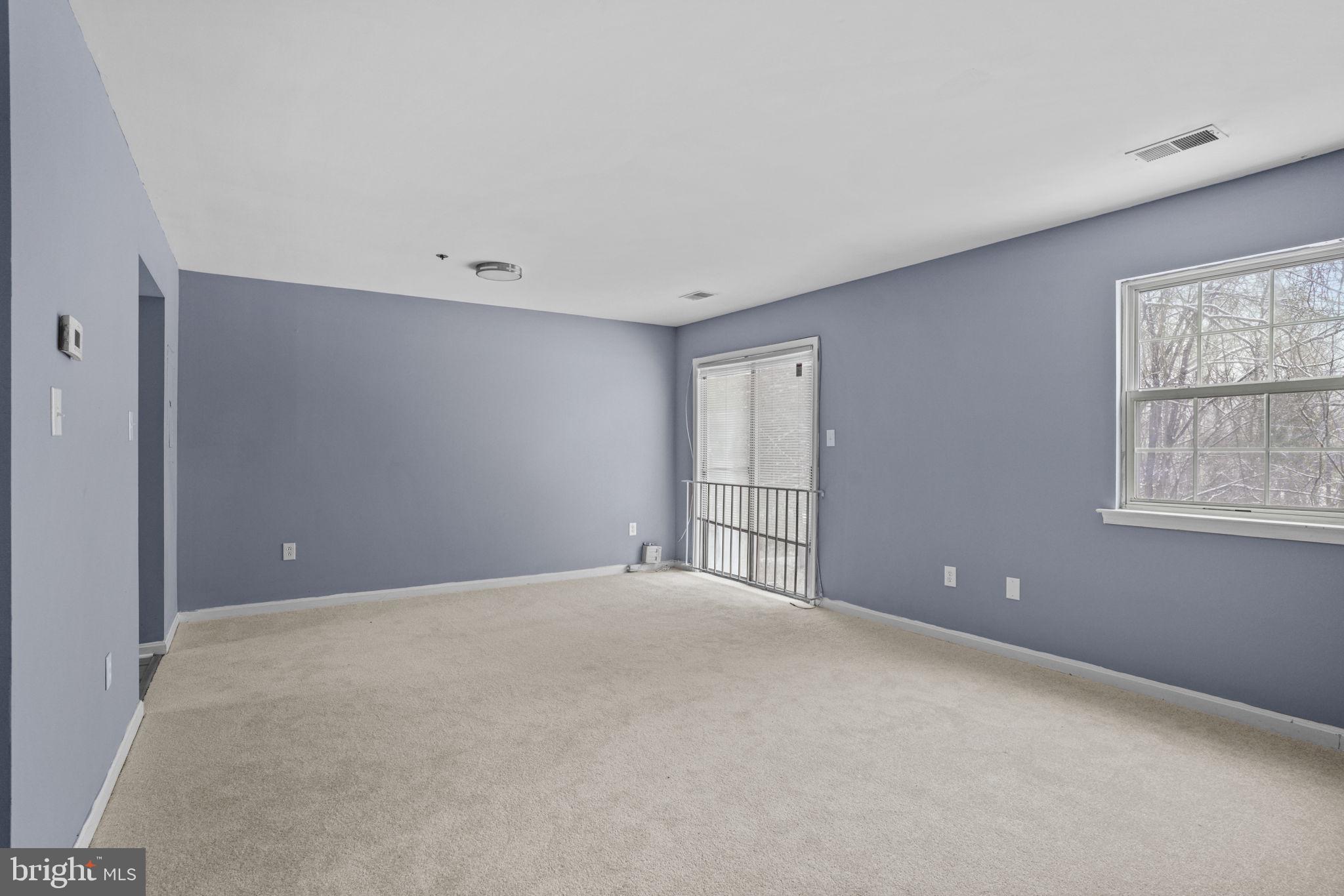 11206 Hannah Way, Unit 4 Upper Marlboro, MD 20774 - Photo 7 of 25 a view of an empty room with a window