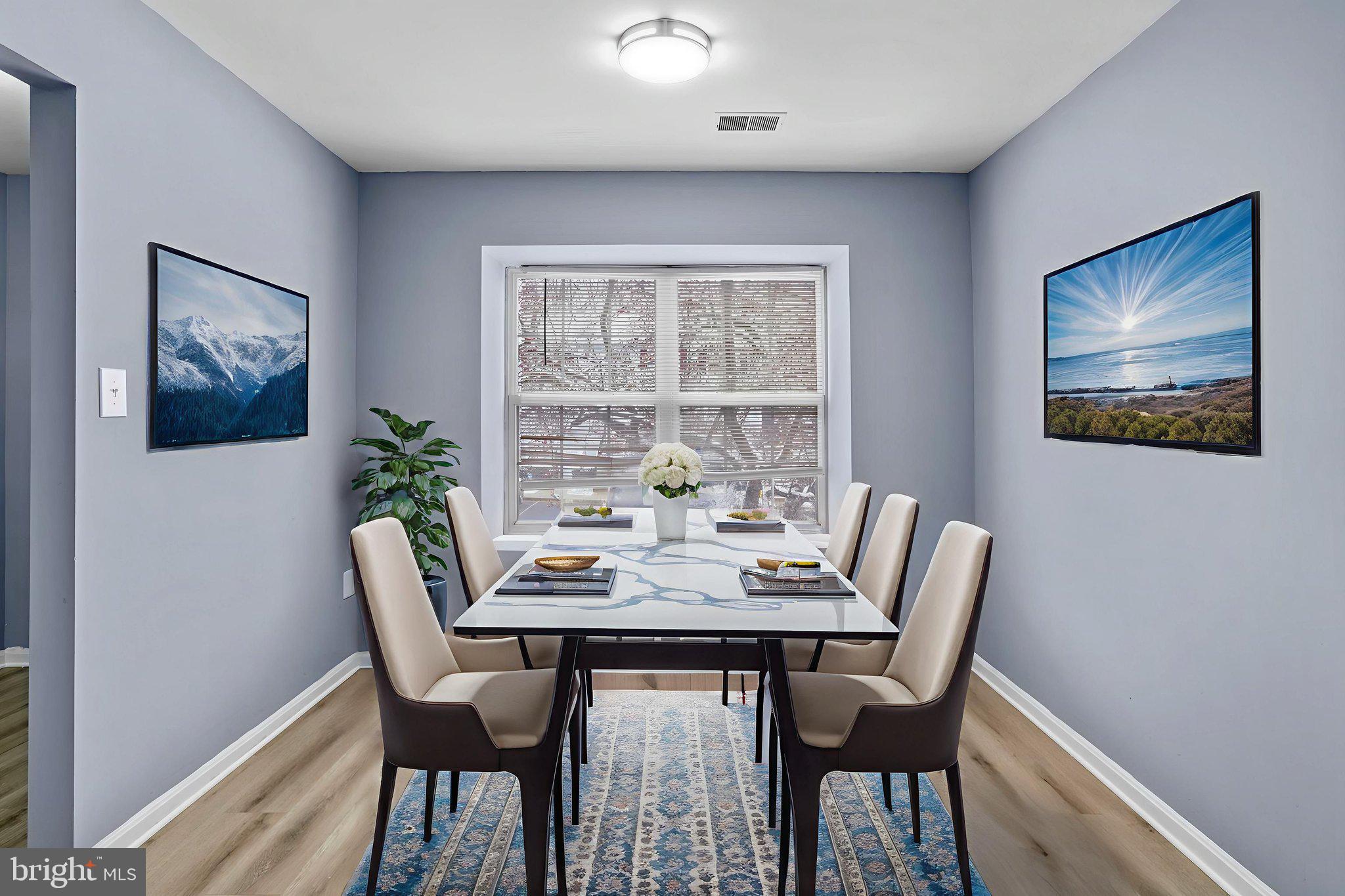 11206 Hannah Way, Unit 4 Upper Marlboro, MD 20774 - Photo 10 of 25 a view of a dining room with furniture window and wooden floor