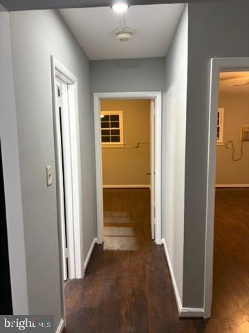 44 49th Street Southeast, Unit 302 Washington, DC 20019 - Photo 19 of 44 a view of a hallway with wooden floor and a livingroom