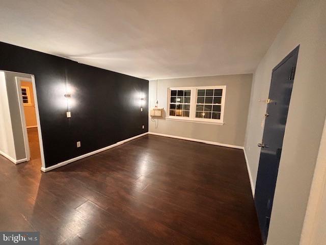 44 49th Street Southeast, Unit 302 Washington, DC 20019 - Photo 2 of 44 an empty room with wooden floor and windows
