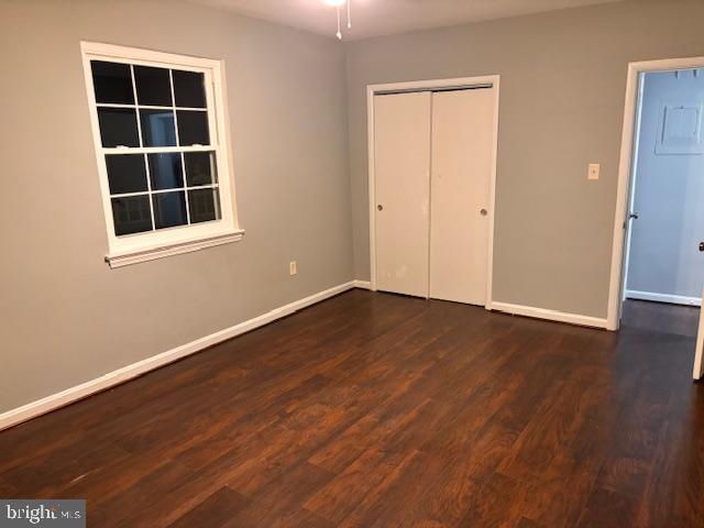 44 49th Street Southeast, Unit 302 Washington, DC 20019 - Photo 28 of 44 an empty room with wooden floor and windows