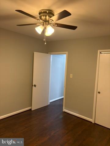 44 49th Street Southeast, Unit 302 Washington, DC 20019 - Photo 38 of 44 an empty room with wooden floor and chandelier fan