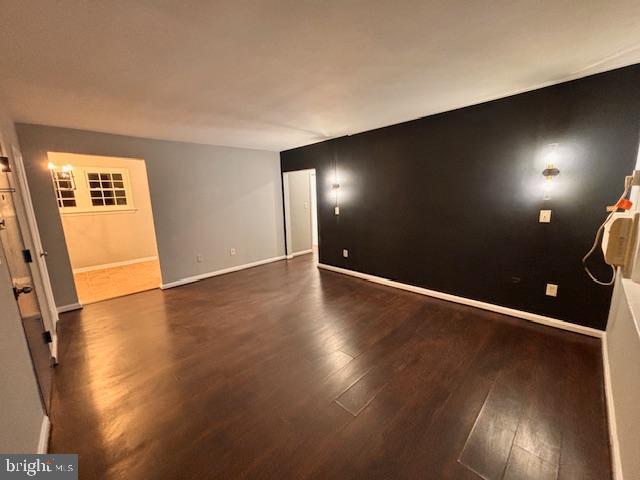 44 49th Street Southeast, Unit 302 Washington, DC 20019 - Photo 5 of 44 an empty room with wooden floor and windows