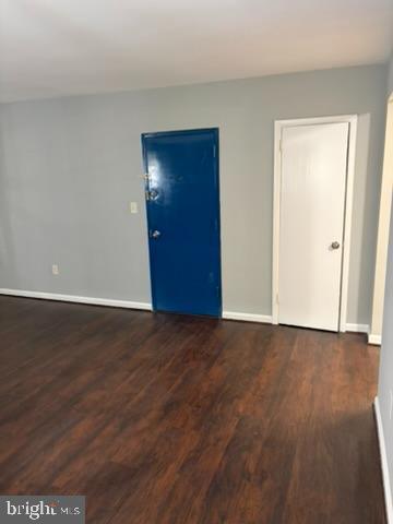 44 49th Street Southeast, Unit 302 Washington, DC 20019 - Photo 6 of 44 a view of an empty room with wooden floor and closet