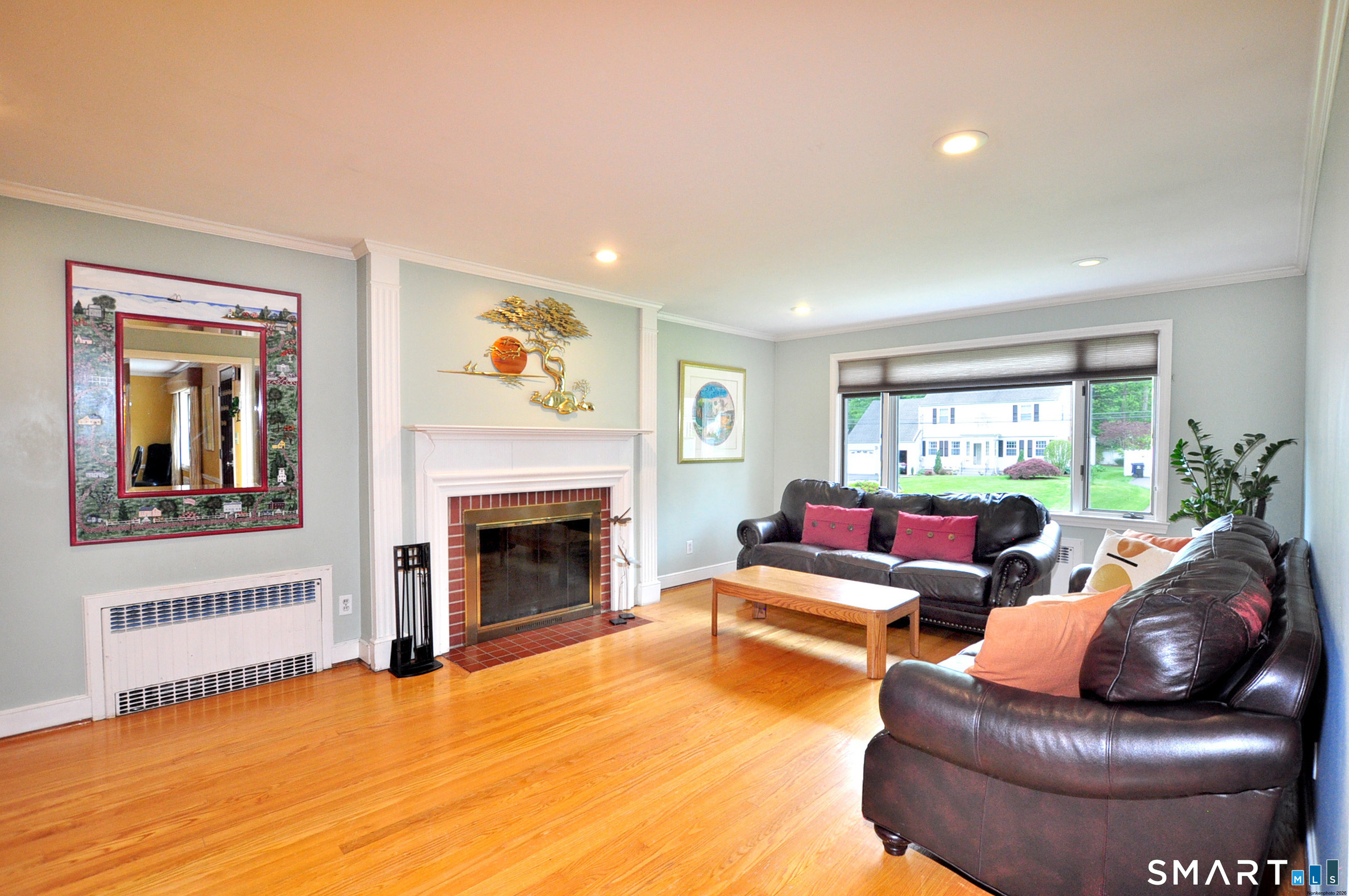 44 Miamis Road West Hartford, CT 06117 - Photo 6 of 39 a living room with furniture and a fireplace