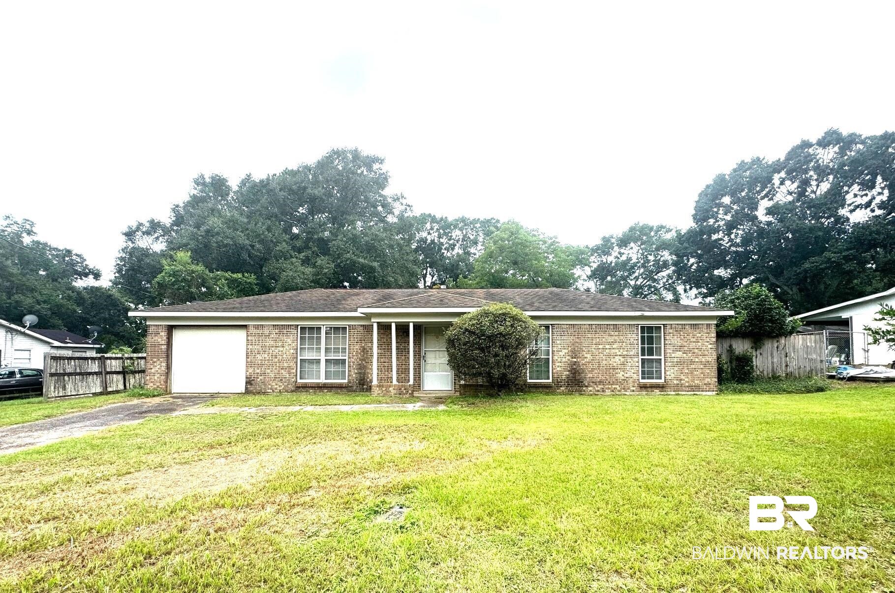 5198 Lancelot Drive Mobile, AL 36619 - Photo 1 of 30 Ranch-style home with a garage, brick siding, and driveway
