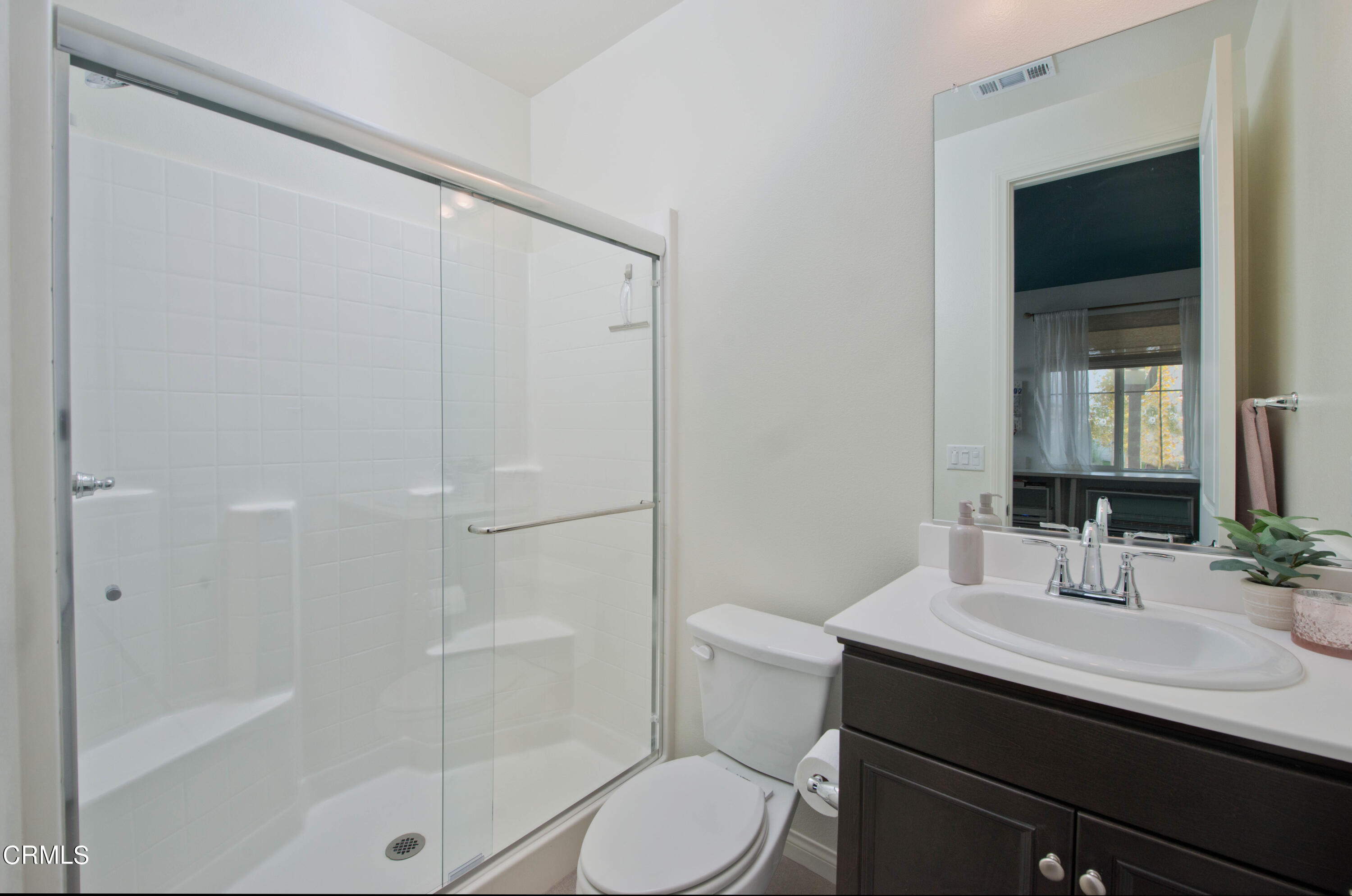 385 Azalea Street Fillmore, CA 93015 - Photo 22 of 50 a bathroom with a sink toilet a mirror and shower
