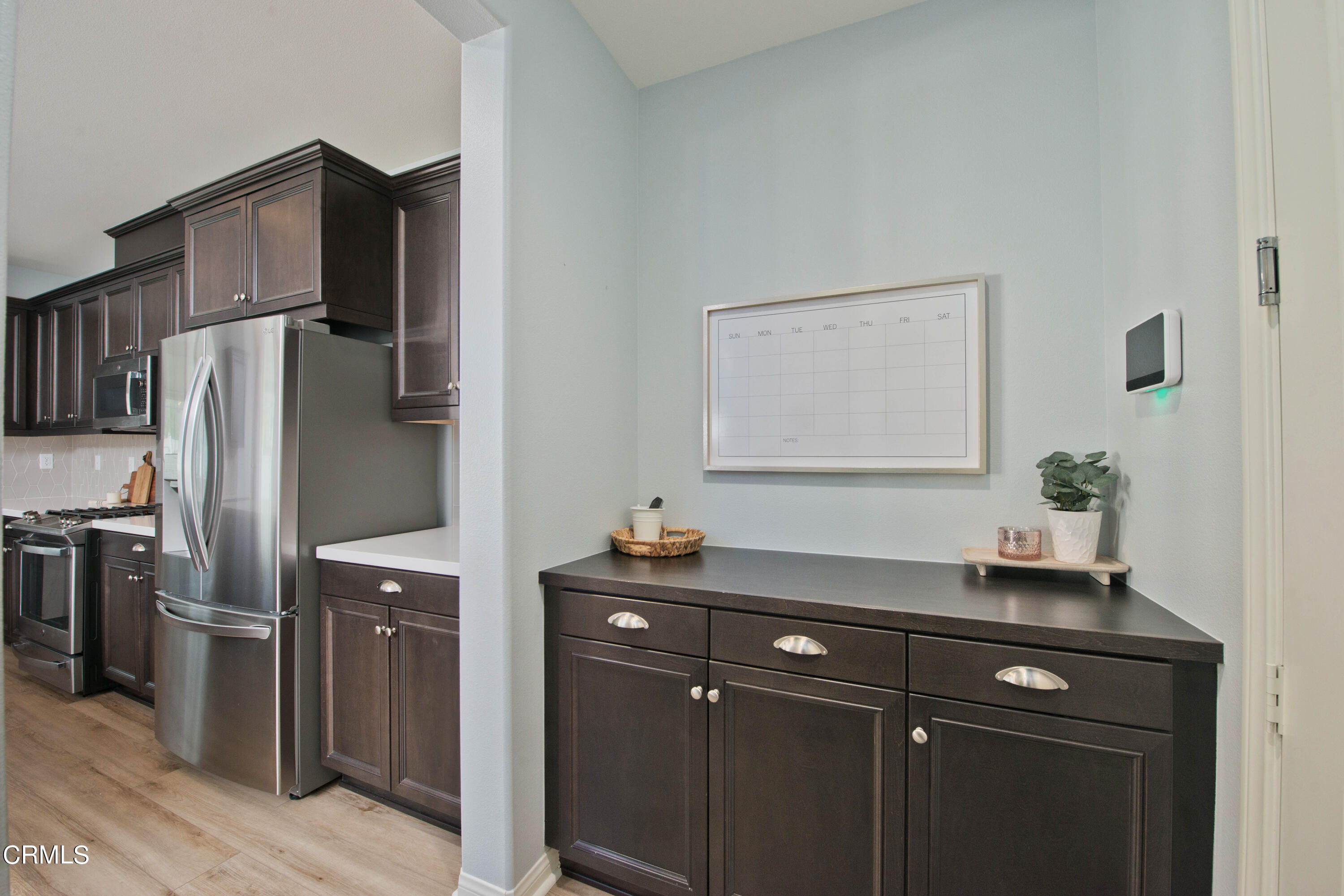 385 Azalea Street Fillmore, CA 93015 - Photo 24 of 50 a kitchen with a sink and refrigerator