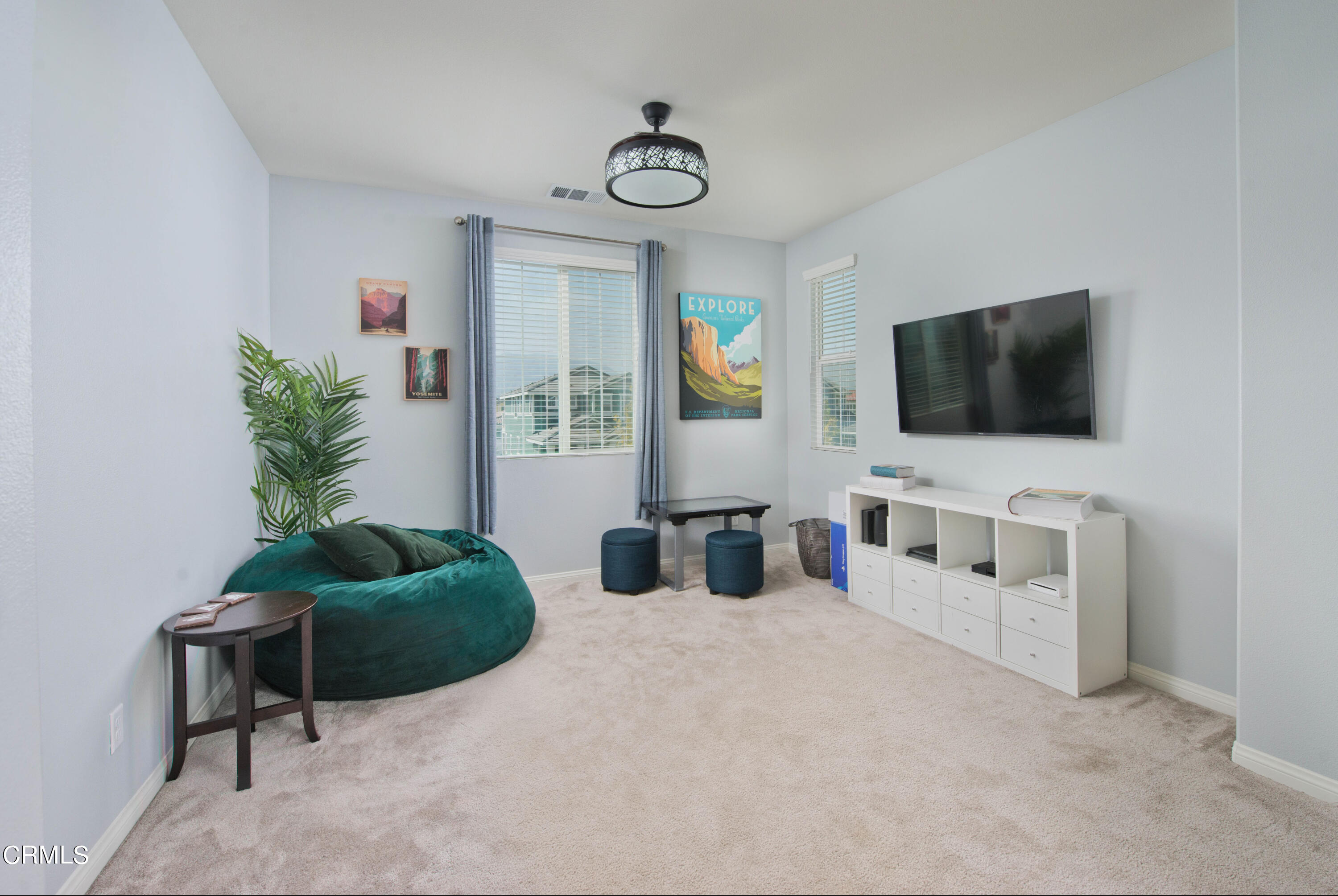 385 Azalea Street Fillmore, CA 93015 - Photo 25 of 50 a living room with furniture and a flat screen tv