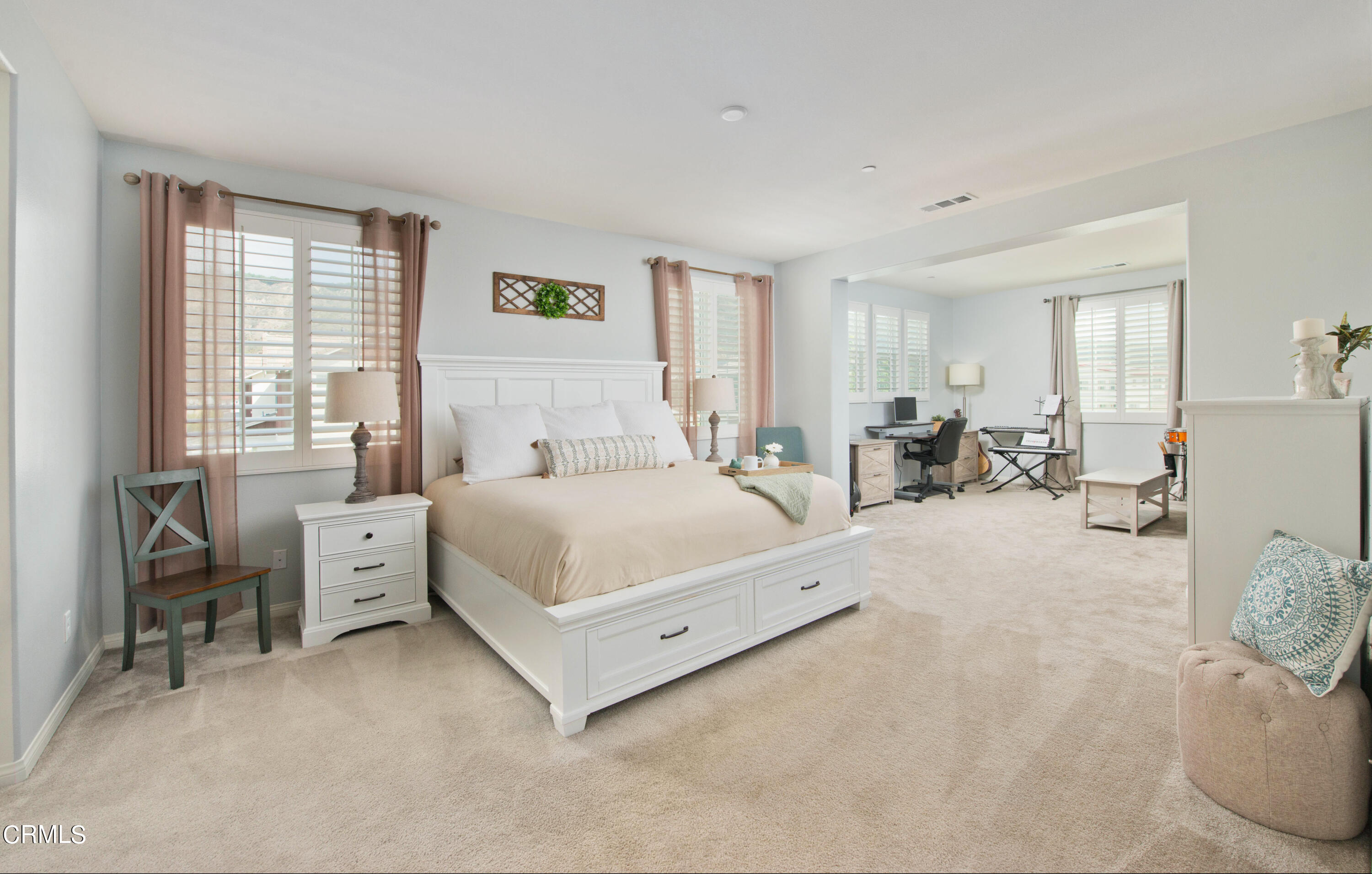 385 Azalea Street Fillmore, CA 93015 - Photo 28 of 50 a bed room with a bed and a chair