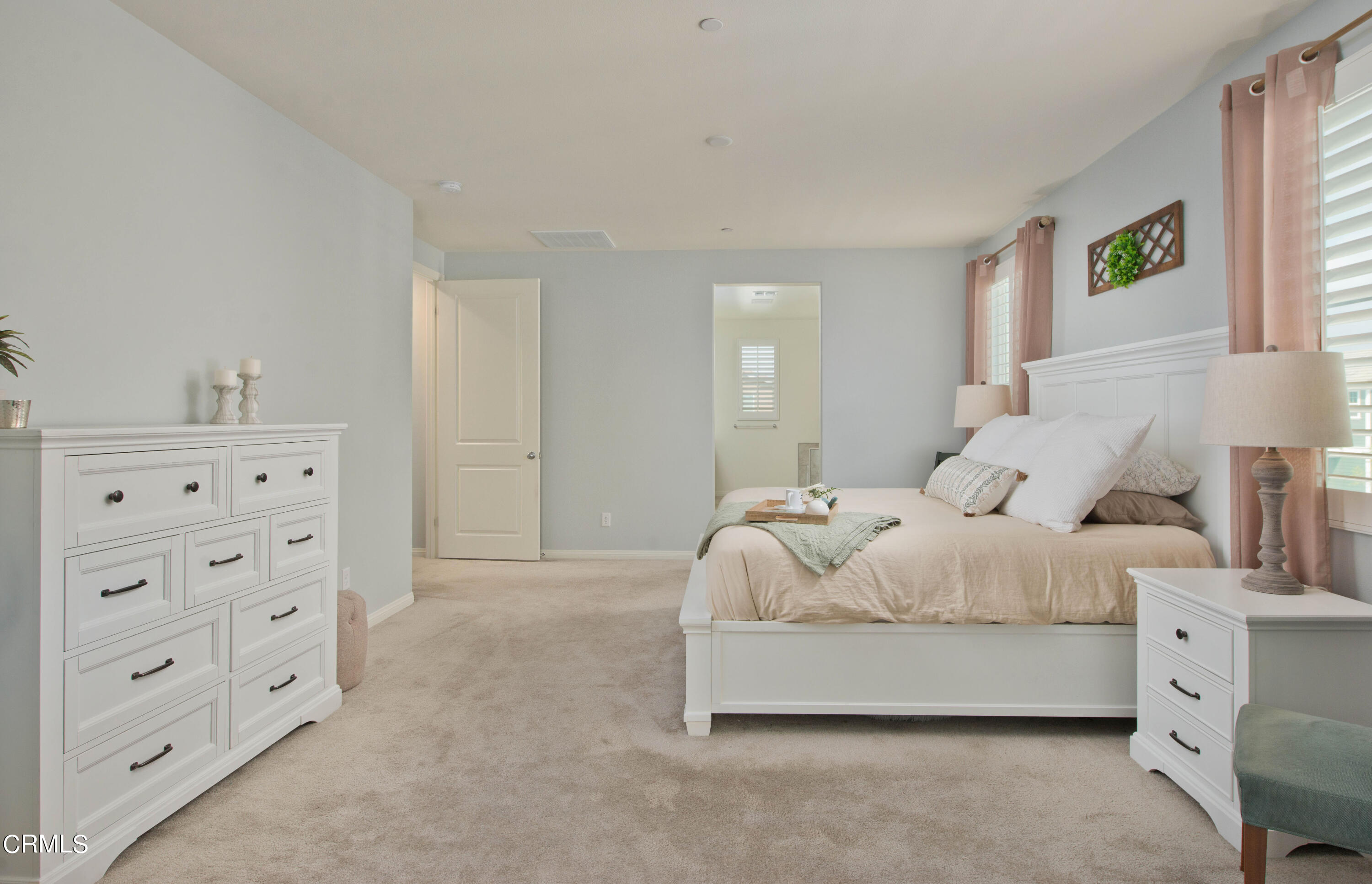 385 Azalea Street Fillmore, CA 93015 - Photo 30 of 50 a spacious bedroom with a bed and a window