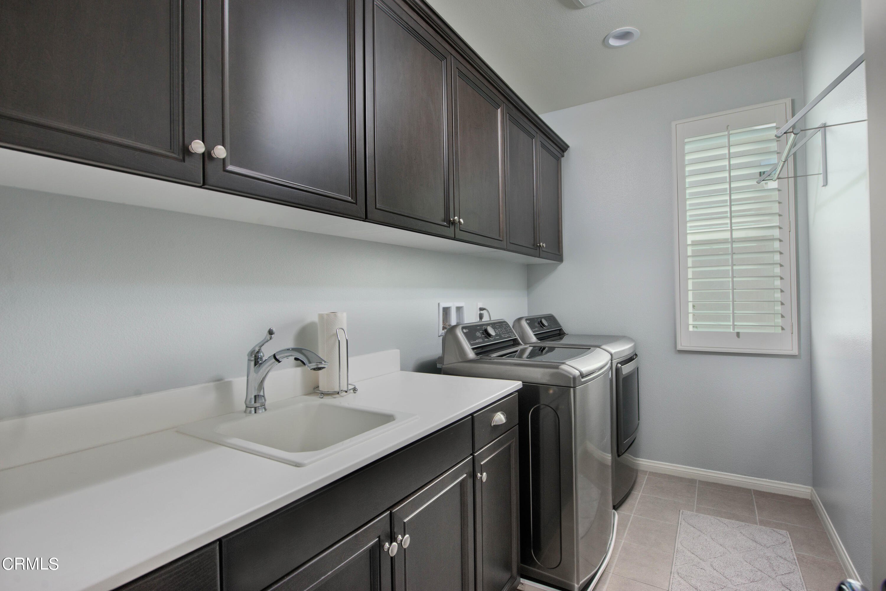 385 Azalea Street Fillmore, CA 93015 - Photo 40 of 50 a kitchen with stainless steel appliances granite countertop a sink stove and cabinets
