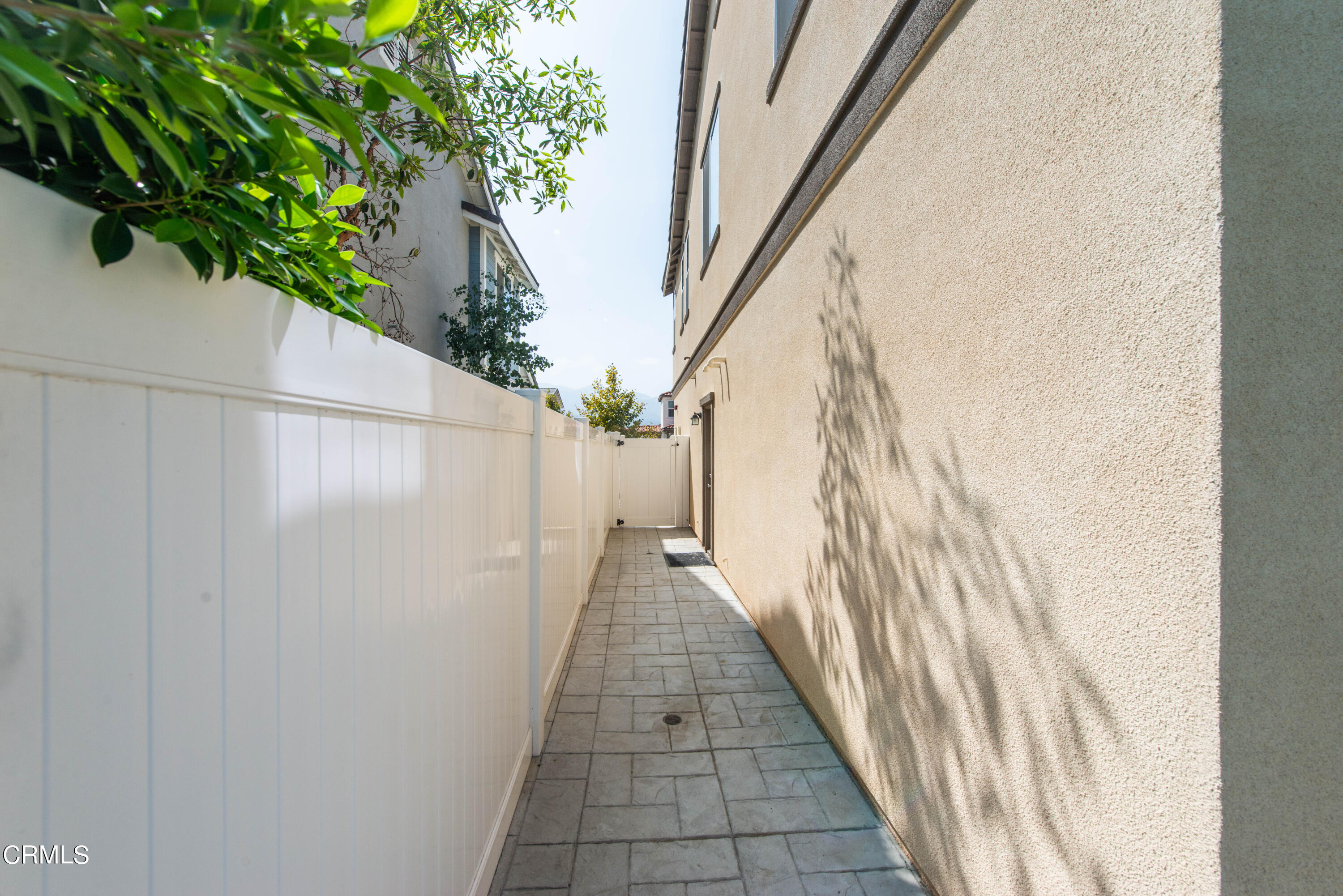 385 Azalea Street Fillmore, CA 93015 - Photo 45 of 50 a view of a pathway of a house with brick walls