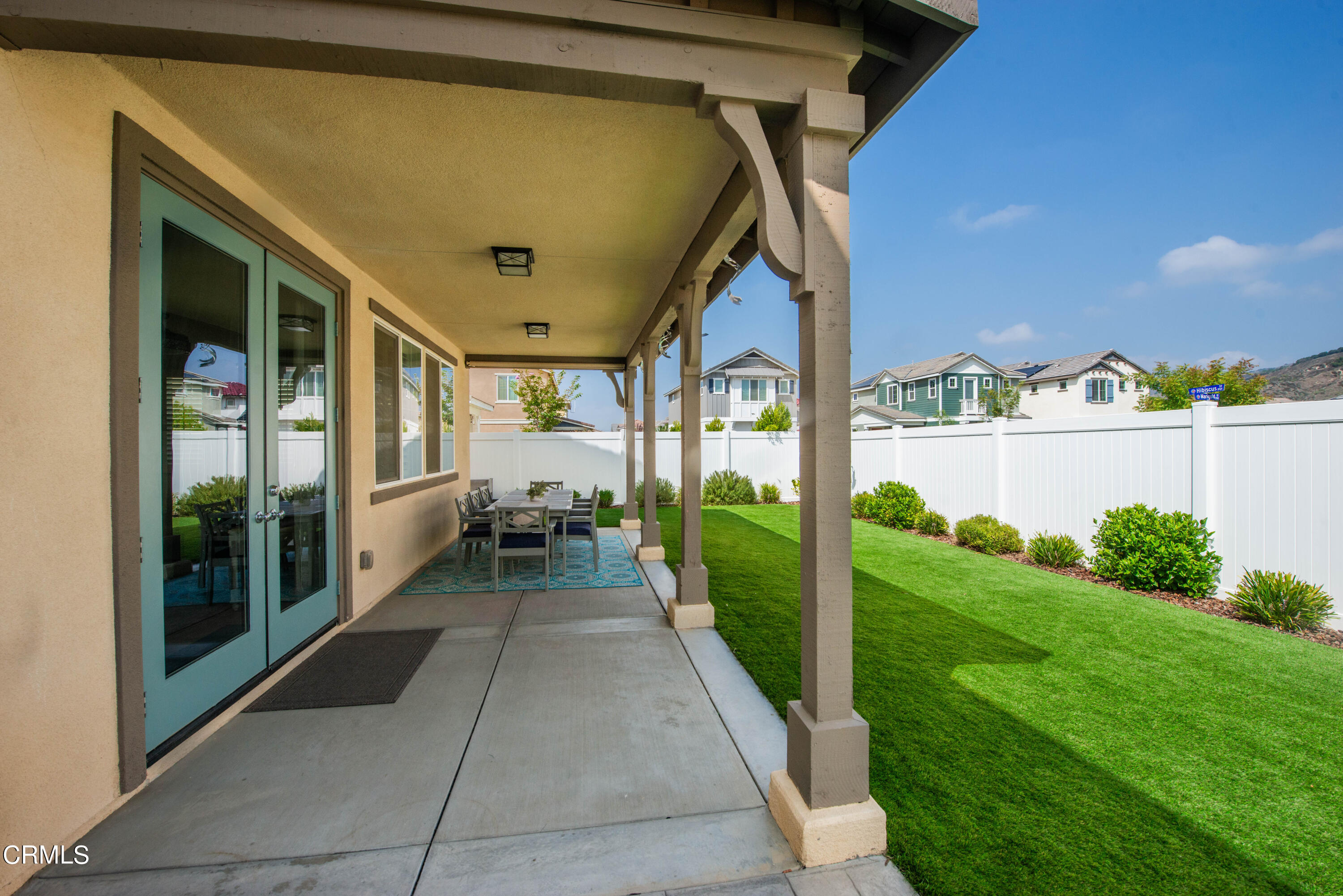 385 Azalea Street Fillmore, CA 93015 - Photo 47 of 50 a view of a porch with chairs and backyard