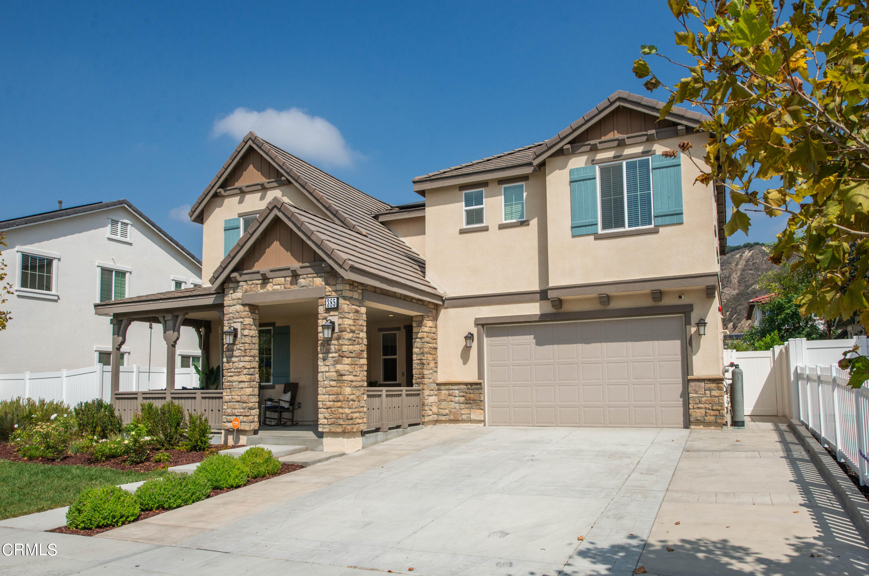 385 Azalea Street Fillmore, CA 93015 - Photo 5 of 50 a front view of a house with a yard and garage