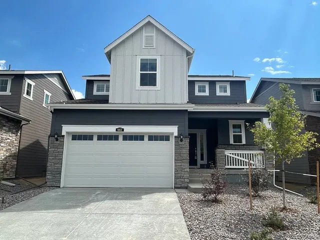 a front view of a house with garage