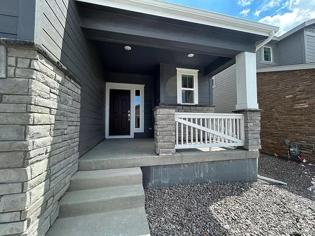 a view of entryway with a front door