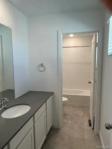 a bathroom with a shower and a toilet