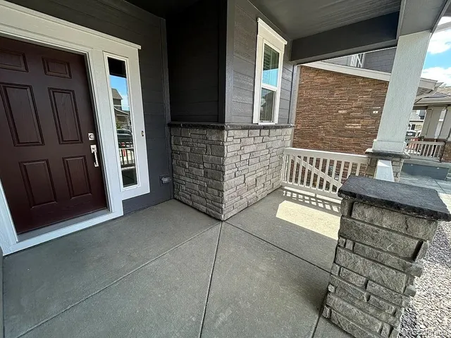 a view of front door of house with stairs