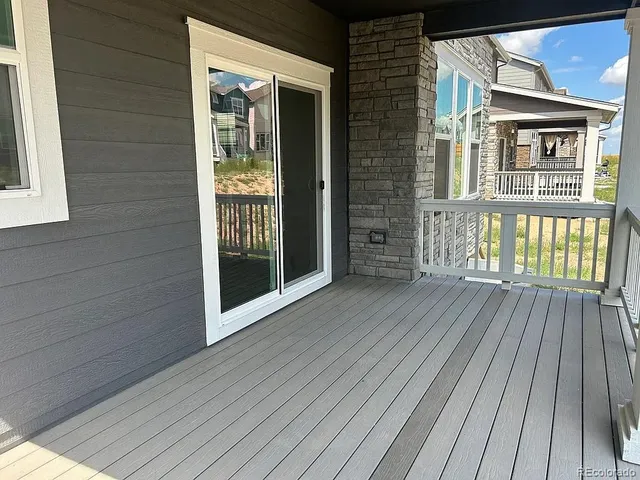a view of backyard with sitting area
