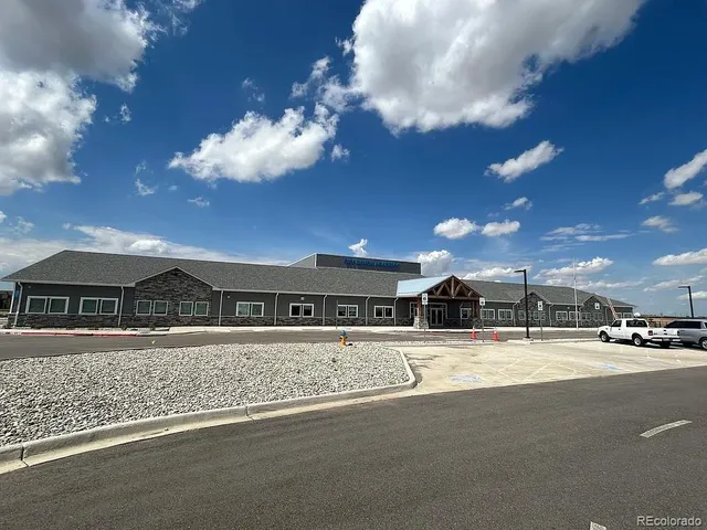 a view of a house with sitting area and furniture