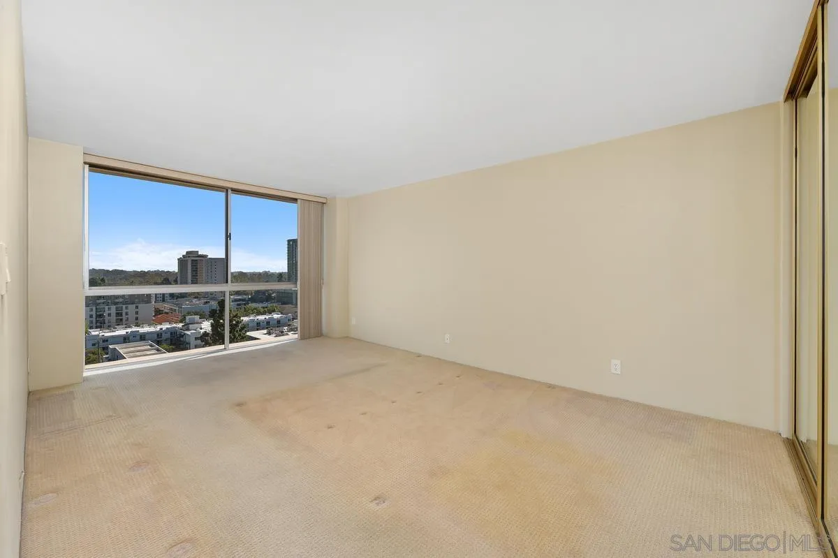 3535 1st Avenue, Unit 15A San Diego, CA 92103 - Photo 24 of 38 a view of a room with a cabinet and flat screen tv