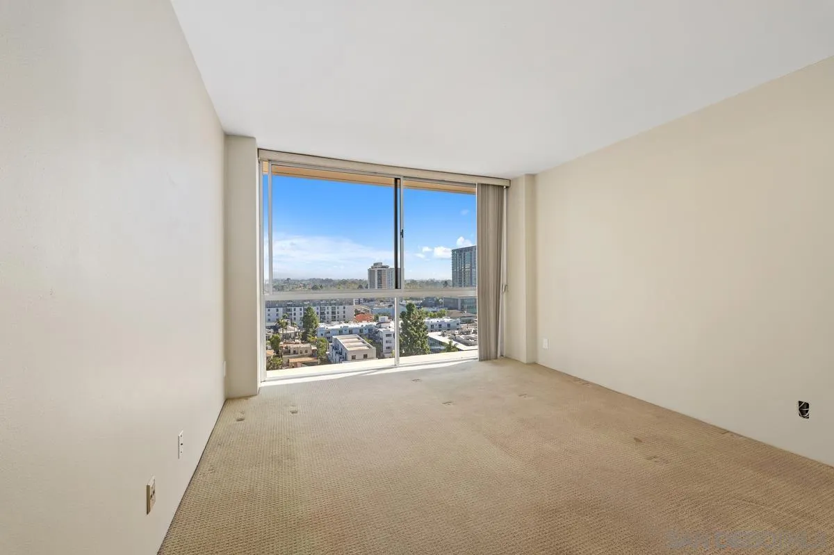 3535 1st Avenue, Unit 15A San Diego, CA 92103 - Photo 27 of 38 an empty room with kitchen area
