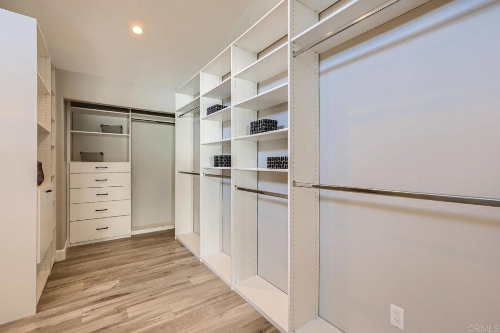 2015 Shadow Grove Way Encinitas, CA 92024 - Photo 16 of 27 a view of walk in closet with empty racks