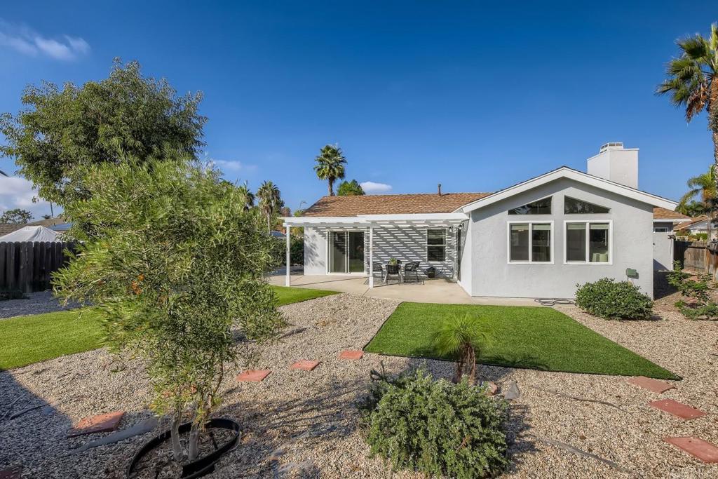 2015 Shadow Grove Way Encinitas, CA 92024 - Photo 24 of 27 a front view of a house with garden