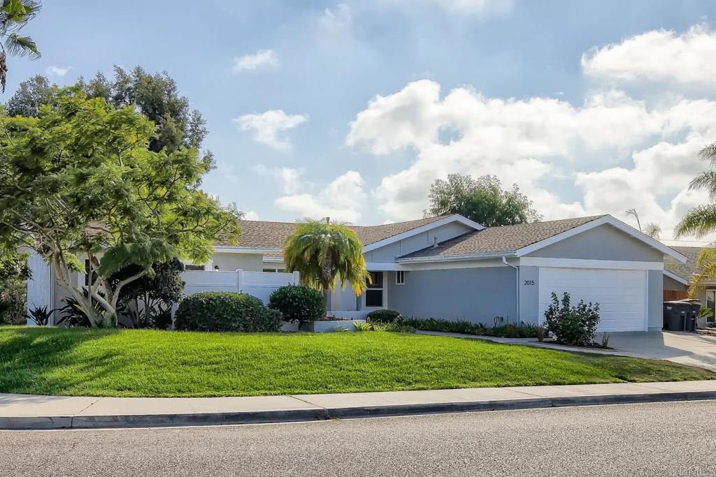 2015 Shadow Grove Way Encinitas, CA 92024 - Photo 26 of 27 a front view of a house with a garden