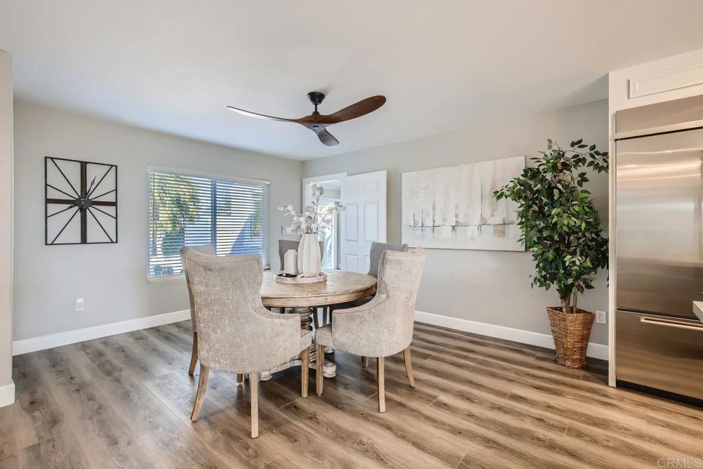 2015 Shadow Grove Way Encinitas, CA 92024 - Photo 3 of 27 a view of a dining room with furniture window and wooden floor