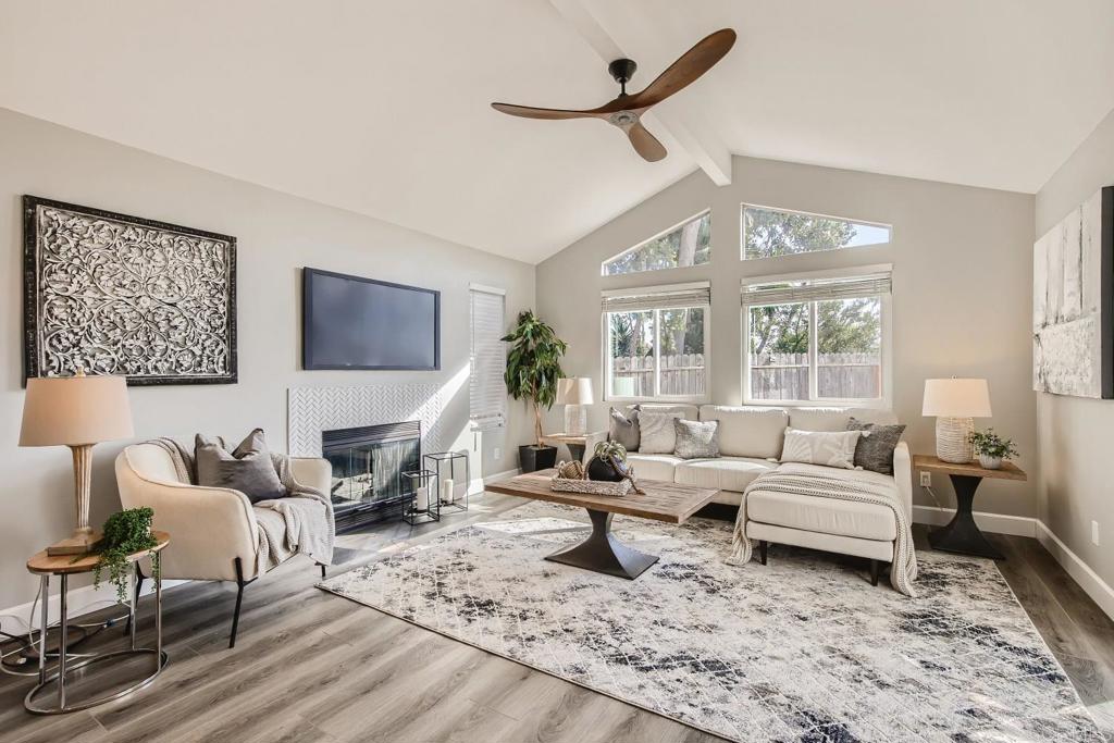 2015 Shadow Grove Way Encinitas, CA 92024 - Photo 9 of 27 a living room with furniture wooden floor and a large window